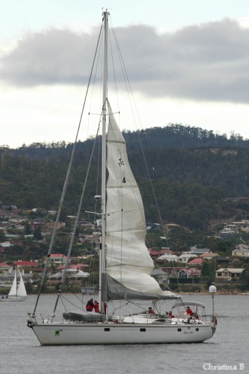 Magic Miles dropping her sail as she's approaching Constitution Dock up the Derwent River in Hobart to drop the two runners off for the last leg of running (up Mount Wellington and back)