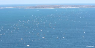 Swimmers and support boats and paddlers in the Rottnest Channel Swim