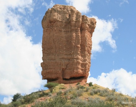 Rock Finger in northwest Namibia measuring 35 metres tall and standing on a hill. It's made of sandstone conglomerate and remained after the surrounding Ugab Terrace washed away thousands of years ago.